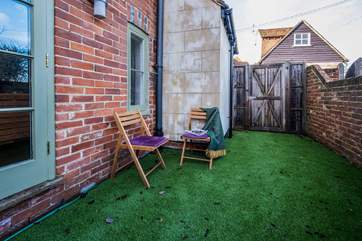 Relax outside in the small garden area.