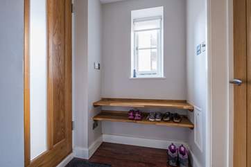 The entrance hall has space for boots and shoes.