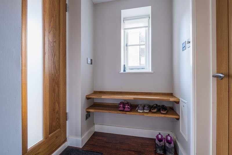 The entrance hall has space for boots and shoes.