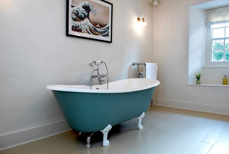 The family bathroom is accessed up a few steps and has a gorgeous free-standing bath, inviting you to chill out and enjoy a long leisurely soak.