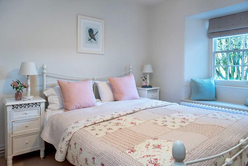 Bedroom 4 is such a pretty room with its charming bed and patchwork quilt.