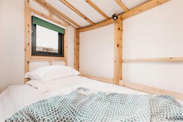 To the right of the roundhouse, you will find the children's room with a double 'boat bed'. Ideal for two young children to share.