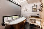 The separate bathroom is beyond gorgeous, just look at that dreamy bath tub!
