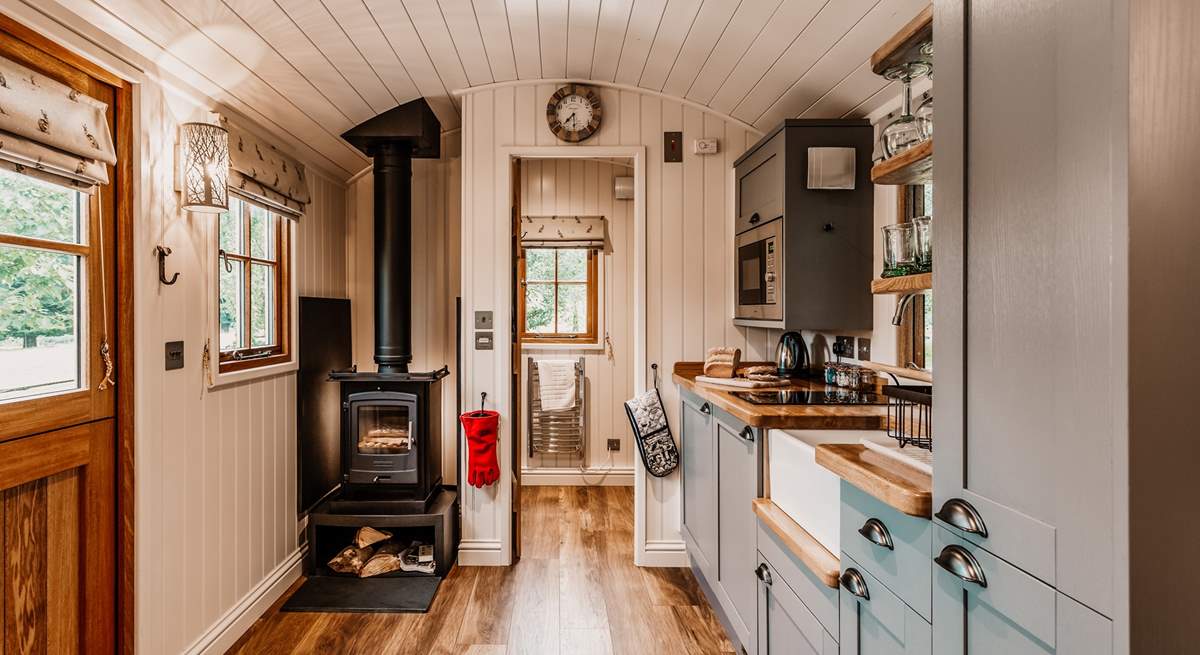 The lovely kitchen area is well-equipped with everything you'll need during your stay.