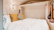 The cosy double bed folds up into the wall, utilising the space perfectly. 