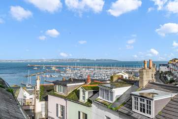 Take in the views over the rooftops to the pretty harbour. The fabulous view from bedroom three.