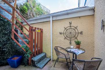 The steps lead from the patio outside the kitchen and they are gated.