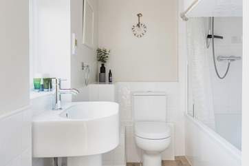 The bathroom on the ground floor has a bath with fitted shower.