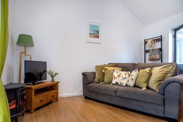 Step into the open plan sitting/dining-room and relax, you are on holiday.