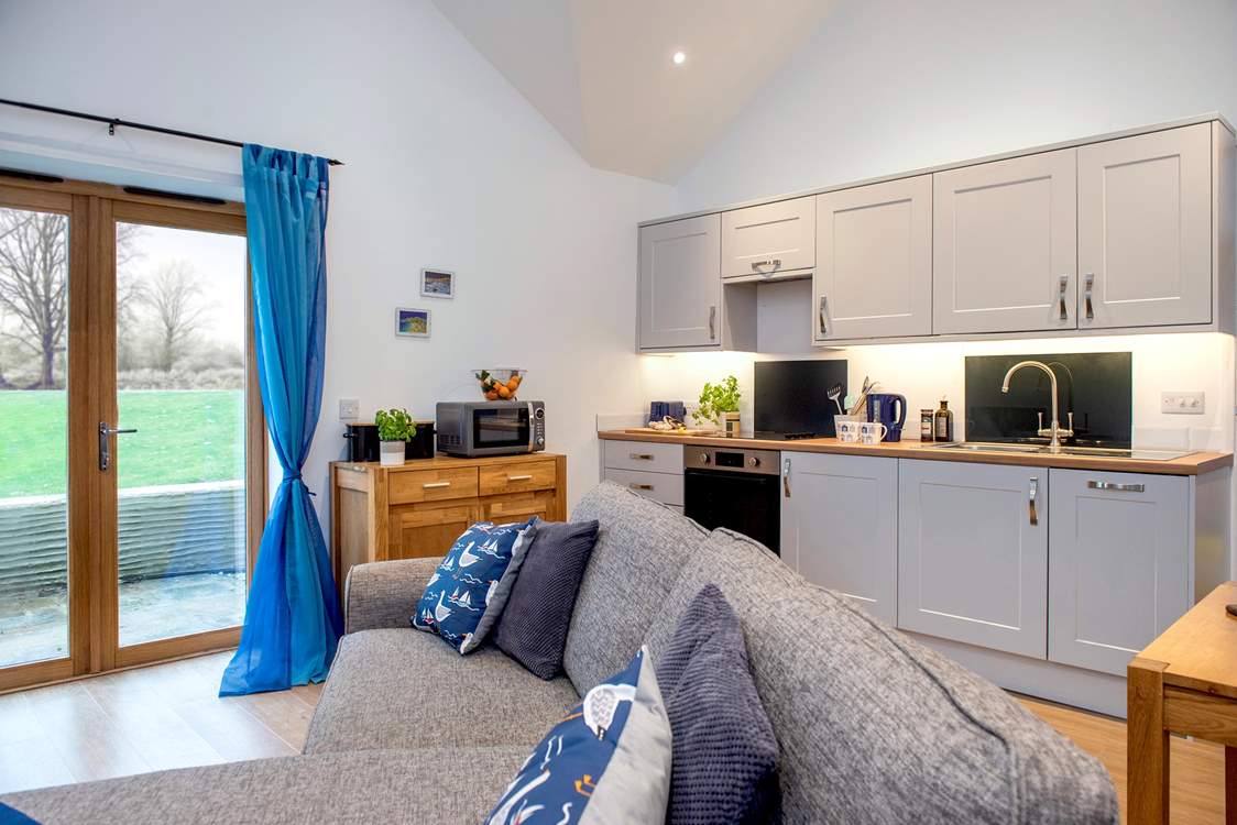 Patio doors take you out to the terrace, the lawned area, shared with the guests of The Dairy, and onto the woodland walks.