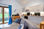Patio doors take you out to the terrace, the lawned area, shared with the guests of The Dairy, and onto the woodland walks.