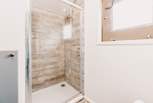 The en suite shower-room is ideal for freshening up. 