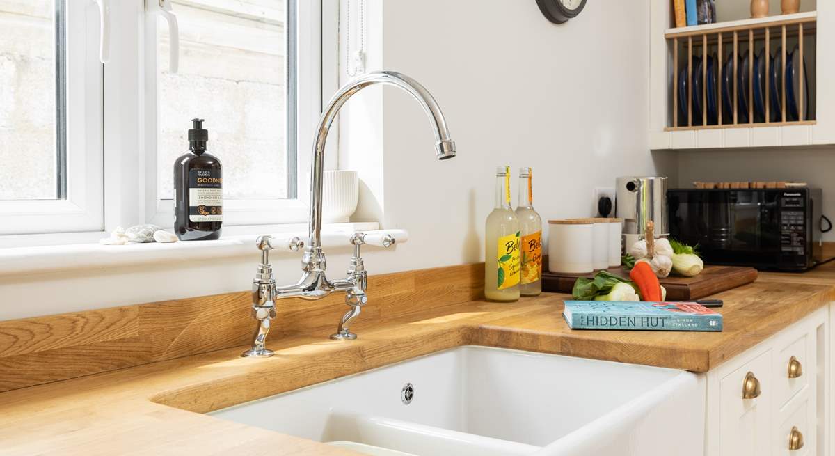 A double Belfast sink, you might just enjoy washing up and if not load up the dishwasher.