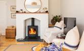 On cooler evenings and in the winter months, keep cosy around the fire. - Thumbnail Image