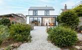 Looking back to the house across the landscaped garden. - Thumbnail Image