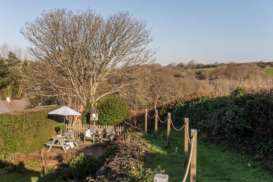 Take three steps up onto the decked area, where magical summer nights await.