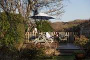 Two steps take you up to the decked seating area. Perch at the picnic table for long, lazy lunches or supper.
