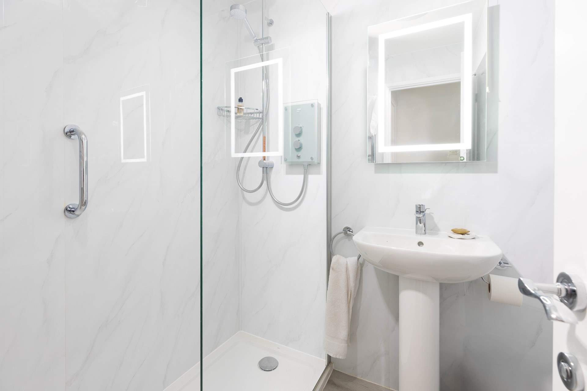 The shower-room also has a handy washing machine and tumble-drier. 