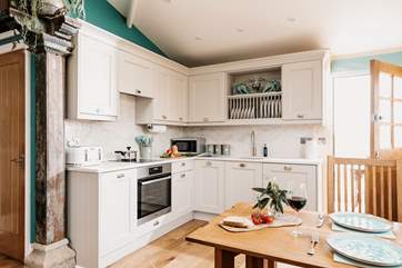 The chic kitchen area is perfectly equipped with everything you'll need.