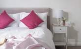 Pretty pinks in bedroom one. - Thumbnail Image