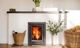 Settle together for cosy nights beside the wood-burning stove. - Thumbnail Image