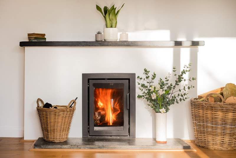Settle together for cosy nights beside the wood-burning stove.