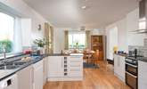 Step over the threshold and the kitchen/dining-room is waiting to greet you. - Thumbnail Image