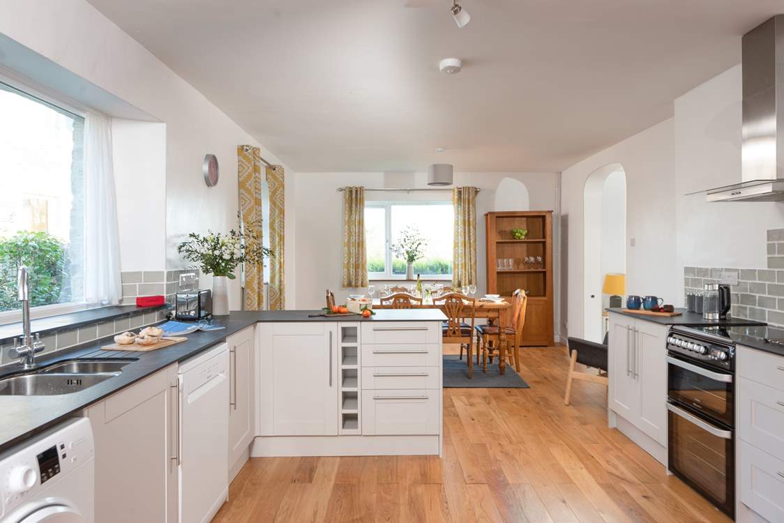 Step over the threshold and the kitchen/dining-room is waiting to greet you.