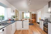 Step over the threshold and the kitchen/dining-room is waiting to greet you.