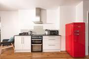 The retro fridge/freezer enhances the stylish kitchen.