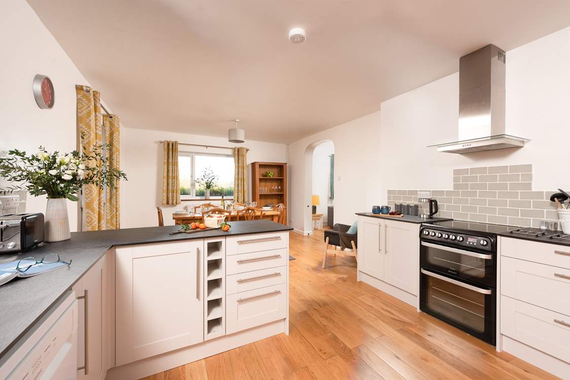 From the dining area, the archway leads through to the sitting-room.