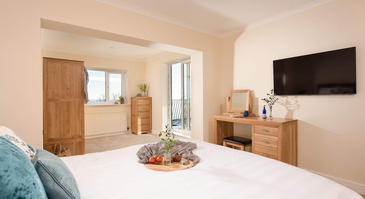 Bedroom one is a wonderfully spacious room with fabulous sea views and access to the first floor balcony.