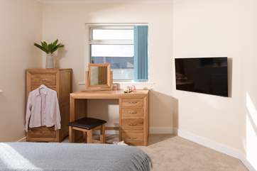 And again in the second bedroom you can snuggle up under the covers and catch up on your favourite programme on the TV.