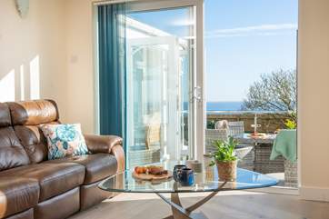 Sliding doors lead out to the terrace from the living-room.