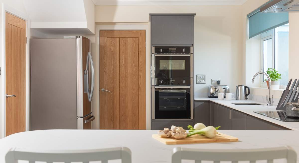 There's a sleek and stylish kitchen along with a utility-room.