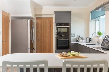 There's a sleek and stylish kitchen along with a utility-room.