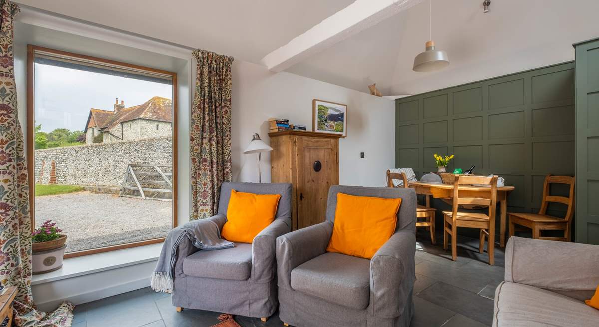 The sitting/dining-room is light and airy.