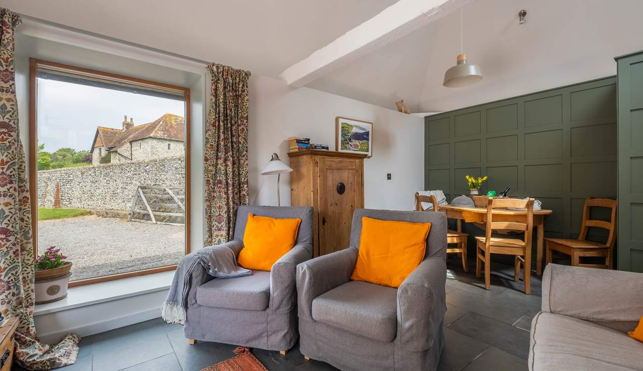 The sitting/dining-room is light and airy.