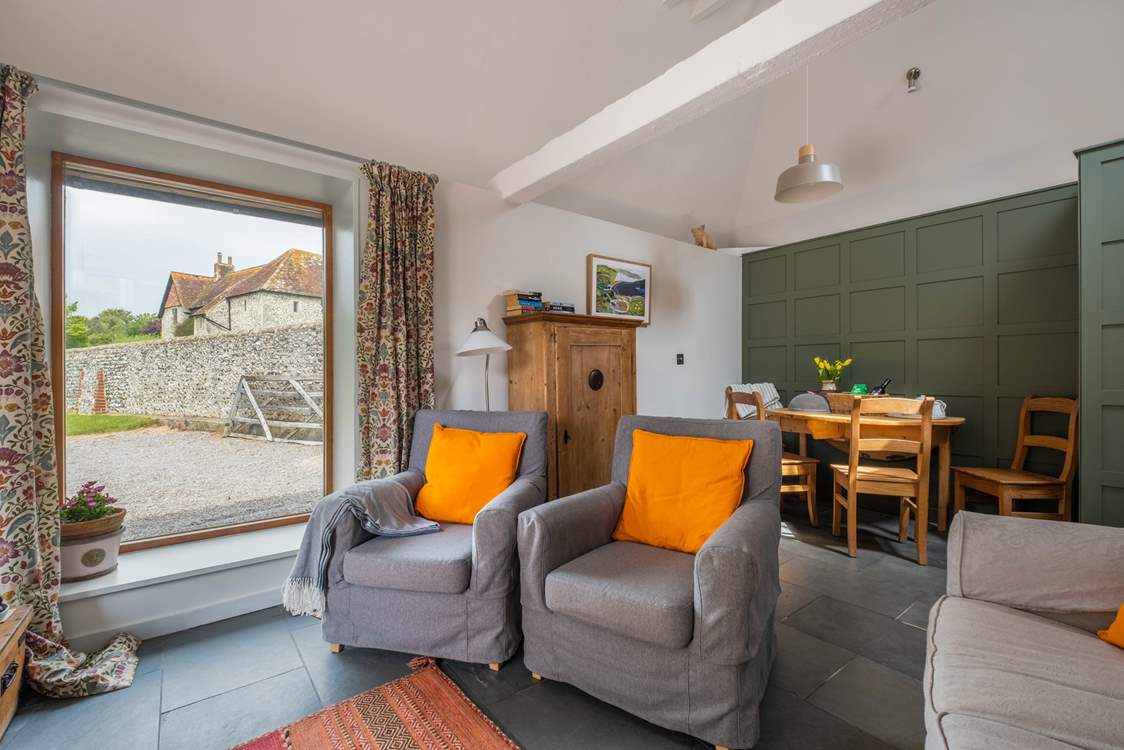 The sitting/dining-room is light and airy.