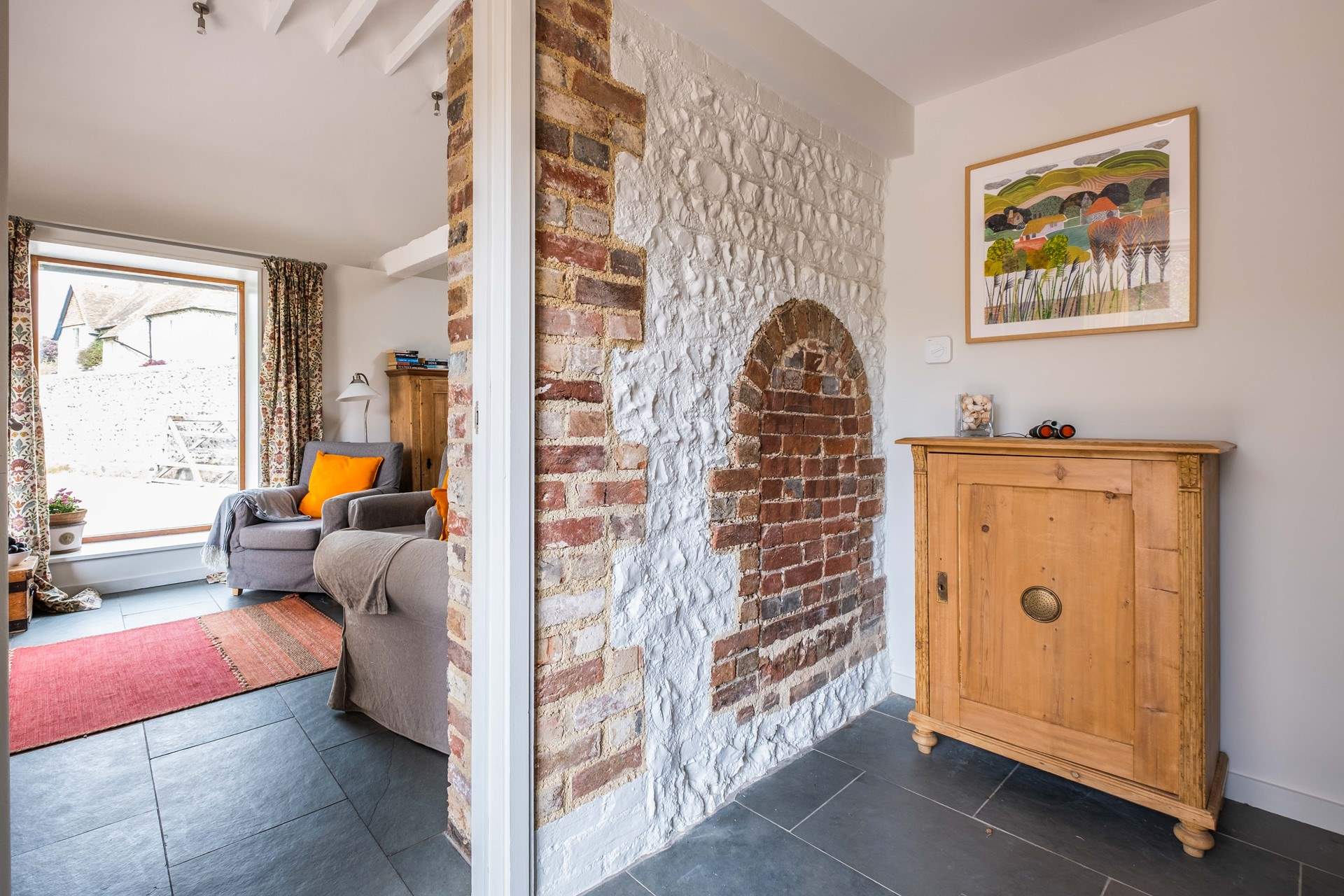 As you enter the hallway you will notice some lovely original features and local artwork.