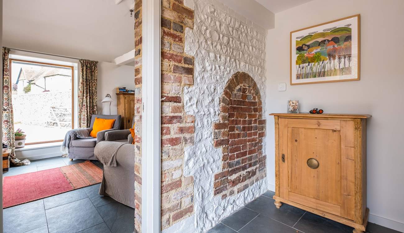 As you enter the hallway you will notice some lovely original features and local artwork.