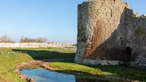 Visit the ruins of Pevensey Castle.