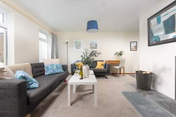 The sitting-room has plenty of space for all the family.