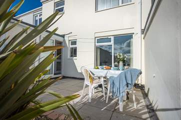 Outside, enjoy the sun on the secluded patio.