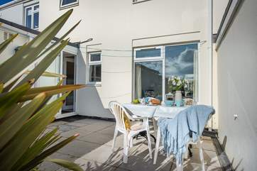 The sheltered patio is perfect for al fresco dining.