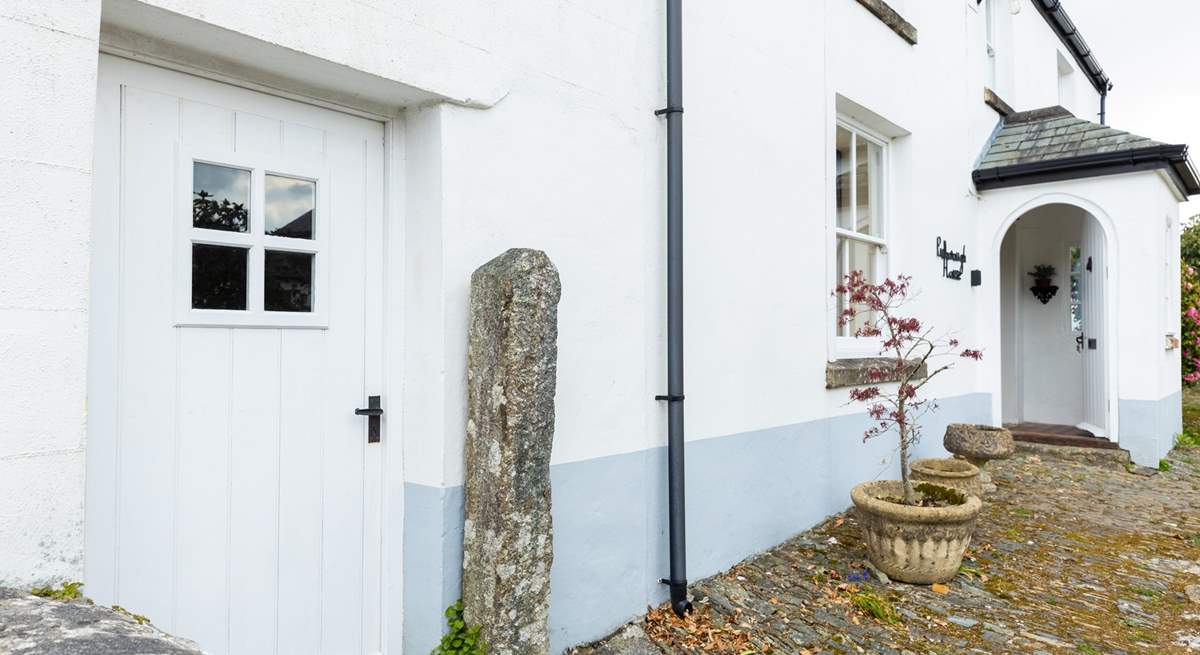 The front door leads into the ground floor living space. 
Please note the bike storage-room with tumble-drier is on the left of this picture.