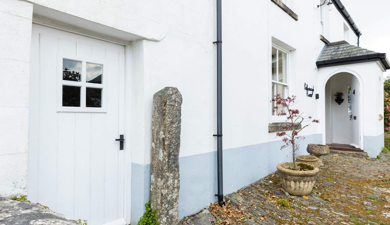 The front door leads into the ground floor living space. 
Please note the bike storage-room with tumble-drier is on the left of this picture.