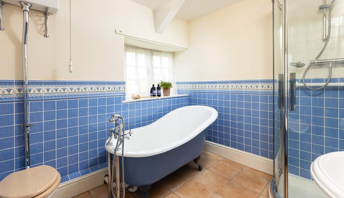 Enjoy a long soak in the roll-top bath after a busy day exploring. 