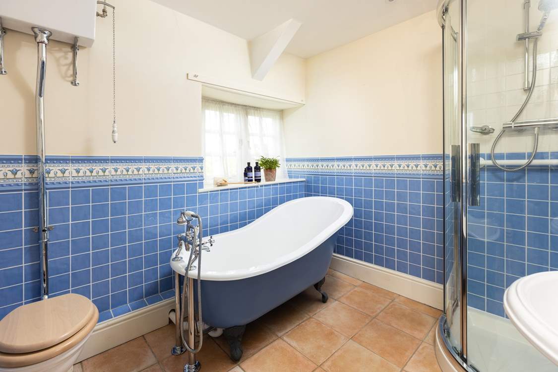 Enjoy a long soak in the roll-top bath after a busy day exploring.