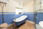 Enjoy a long soak in the roll-top bath after a busy day exploring.